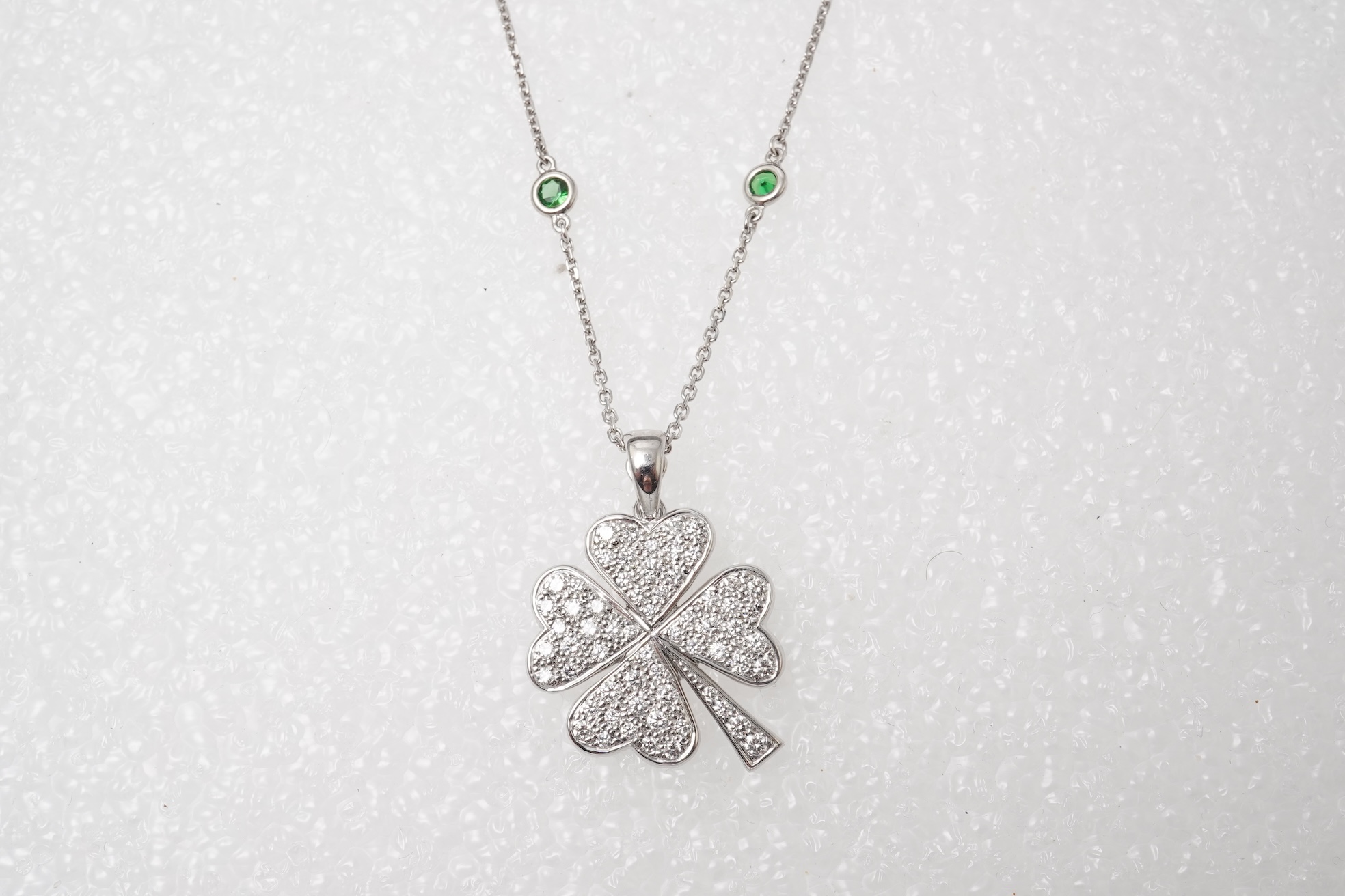 A diamond and tsavorite pendant necklace